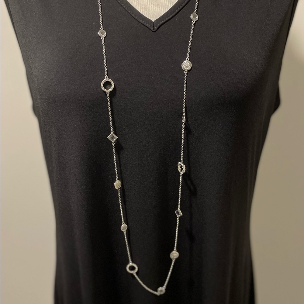 Long silver necklace with rhinestone accents. Endless ways to wear.